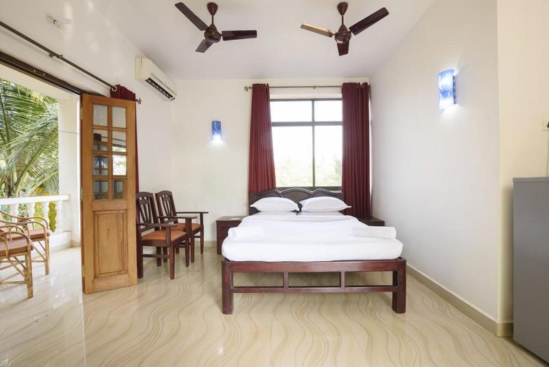 Oyo 13311 The White Feather Hotel Mandrem Bagian luar foto